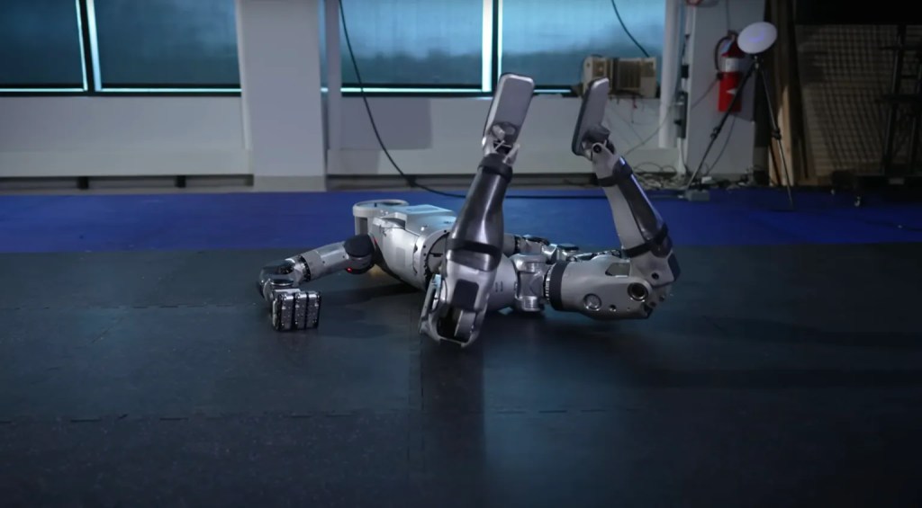 Humanoid robot struggling to maintain balance in awkward pose